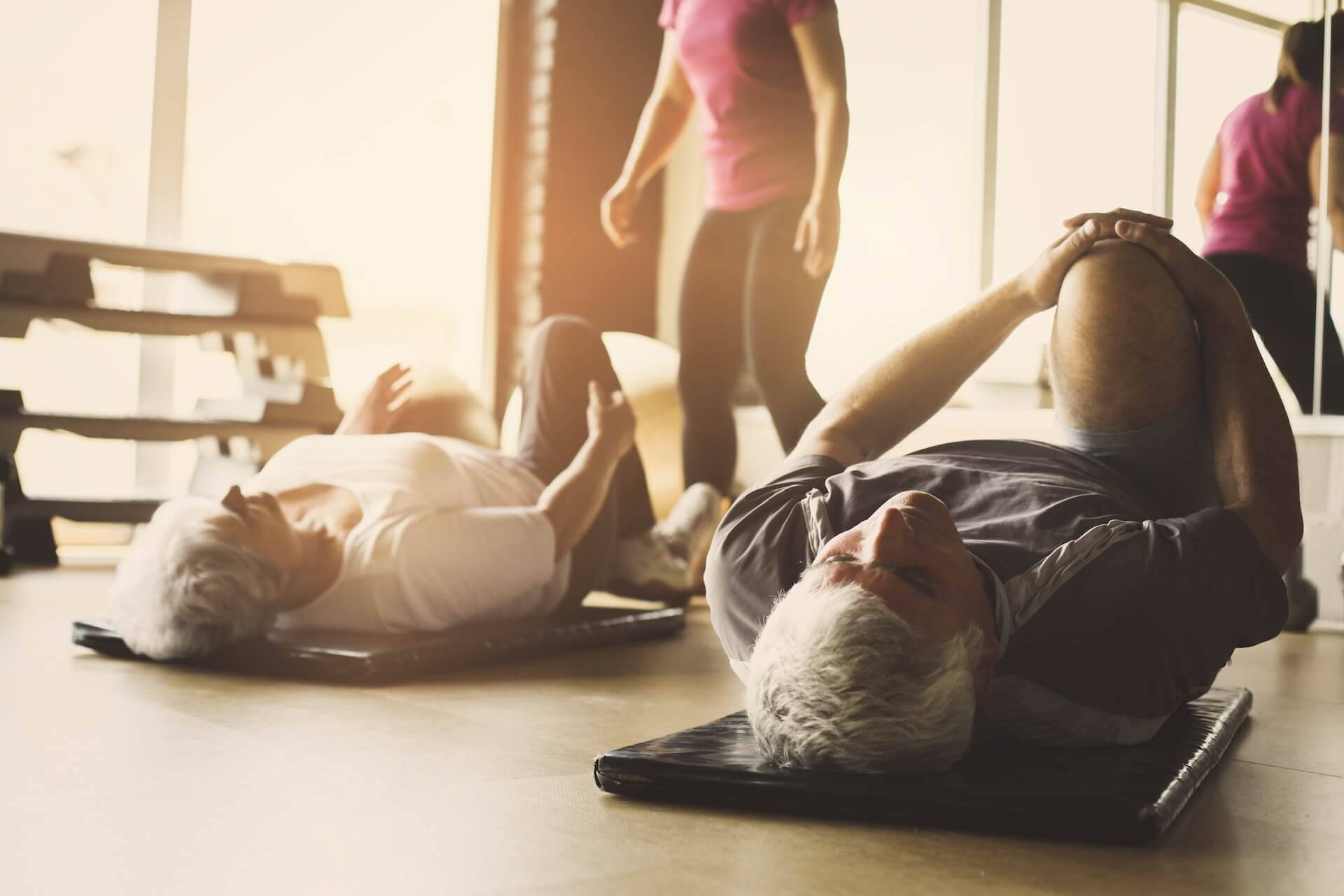 People doing gentle exercise under supervision